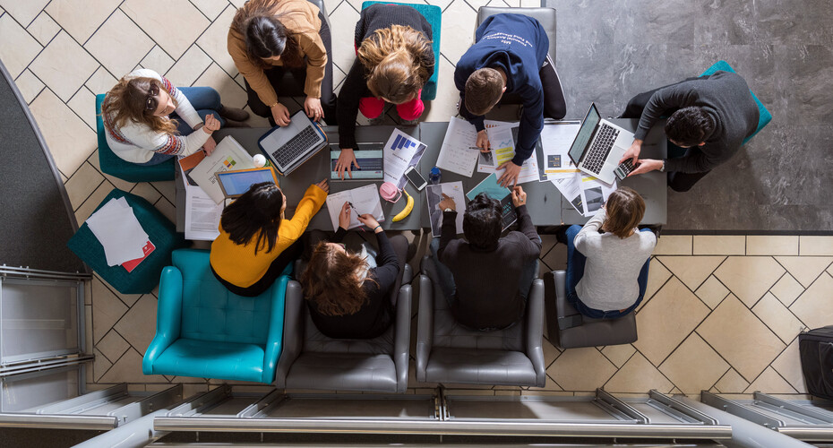 A group of students studying together in the Business School